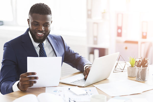 smiling at documents