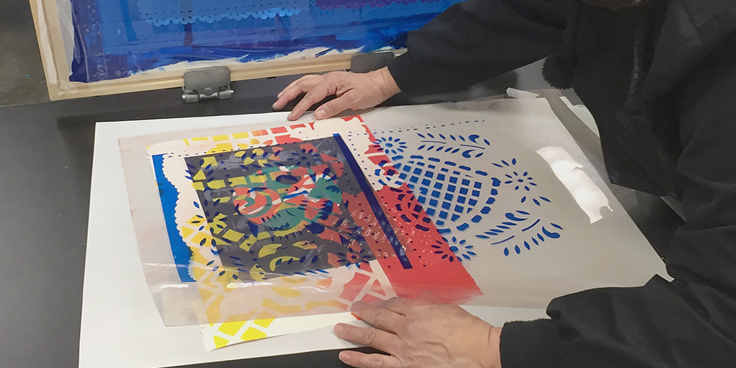 2D Printmaking Student making silkscreen art