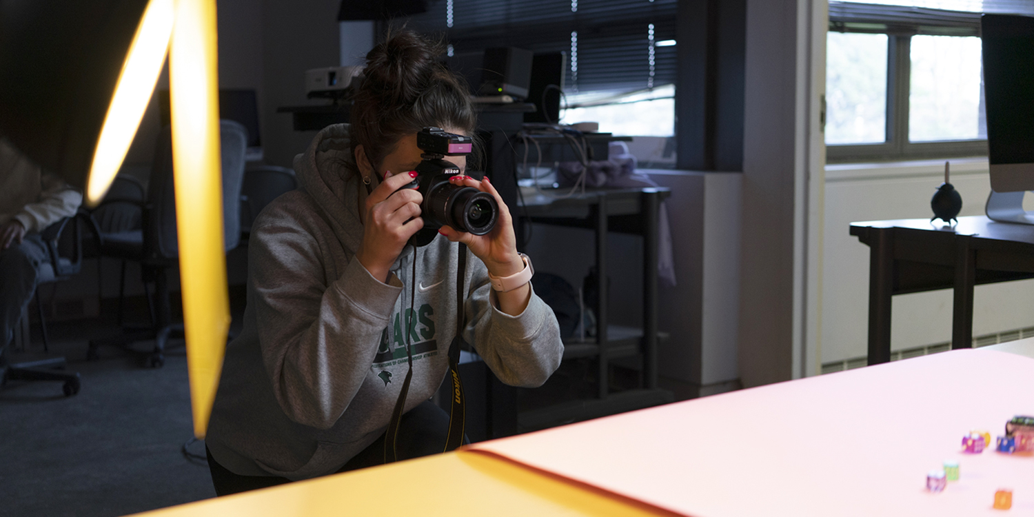 Student is holding camera student is holding camera