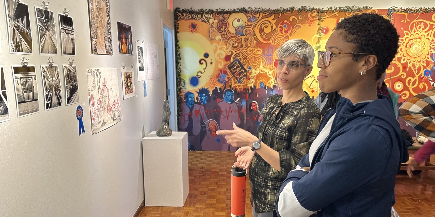 Professor and student discussing artwork Professor and student discussing artwork