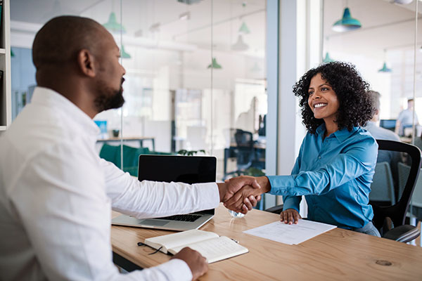 Candidate shaking hand of female interviewer