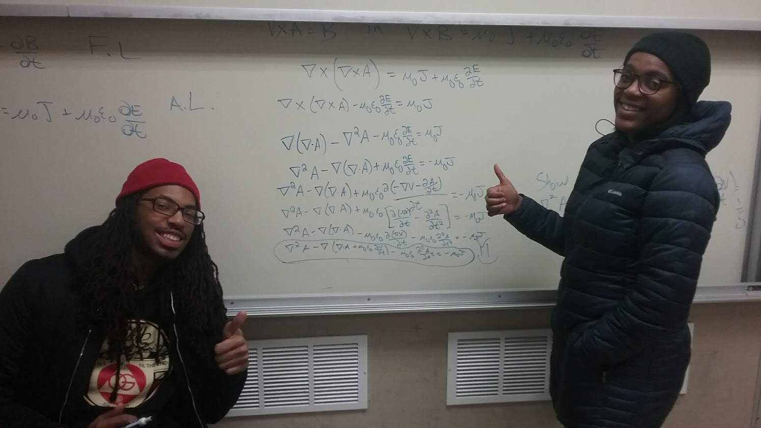 Physics students solving a problem