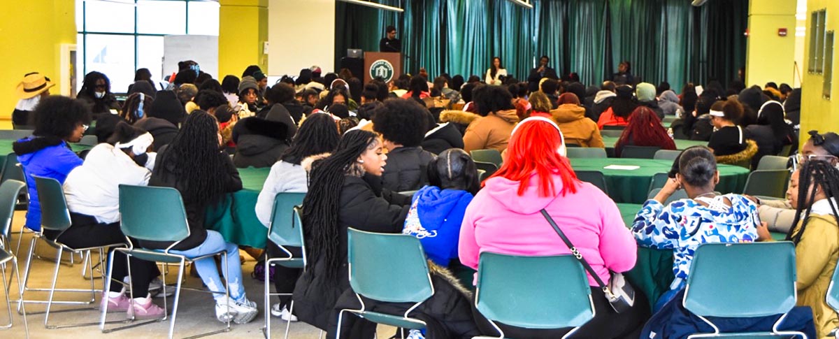A wide-angle, eye-level photo of a large conference room filled with students attending the STEM-Day Hackathon