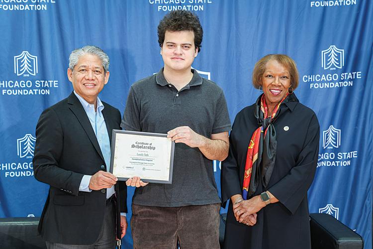 CSU student Laszlo Toth stands between ComEd president Gil Quiniones and and Chicago State University president Z. Scott holding a certificate.