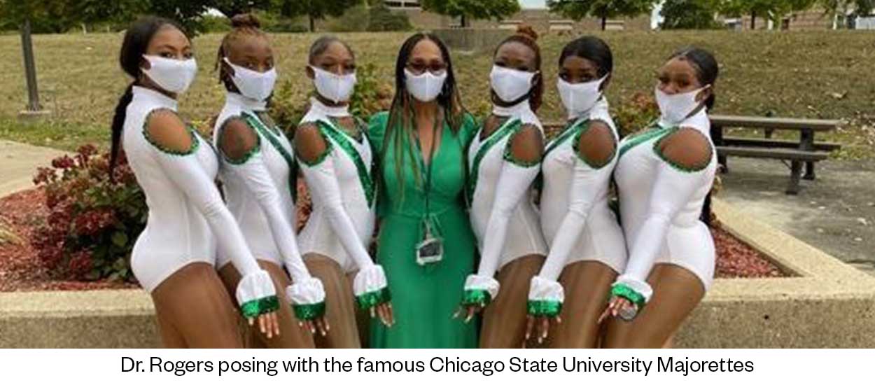 Dr. Rogers posing with the famous CSU Majorettes